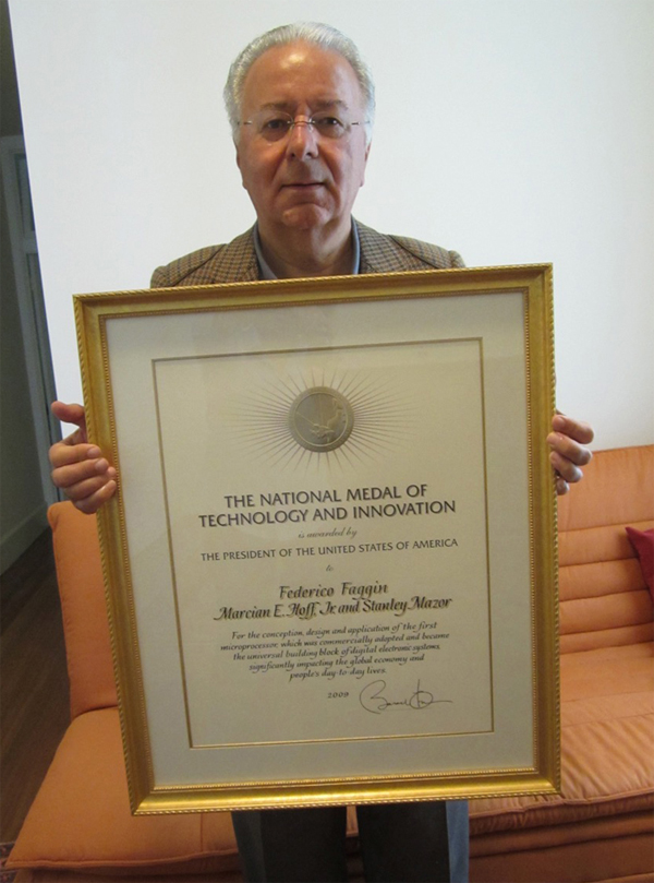 Federico holding the  National Medal of Technology and Innovation diploma